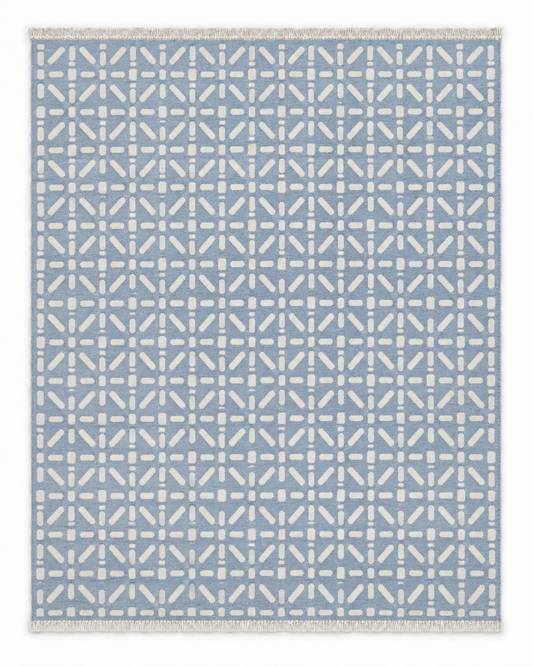 Danton Two Hues rug with white geometric dash pattern on dusty blue