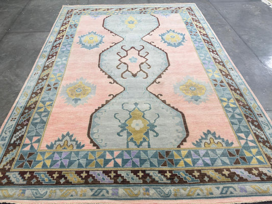 Peach rug with linked blue-gray geometric medallions